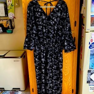 Black white flowered jumpsuit with bell sleeves.